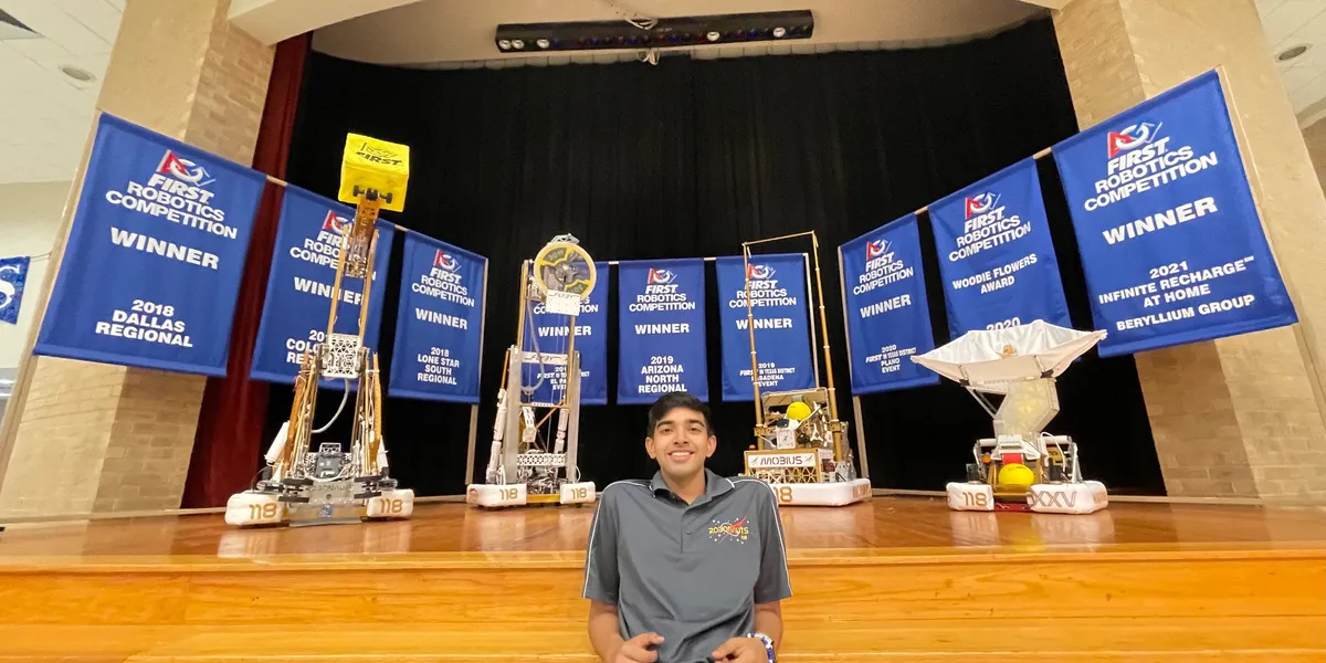Rishi Bengani with robotics awards